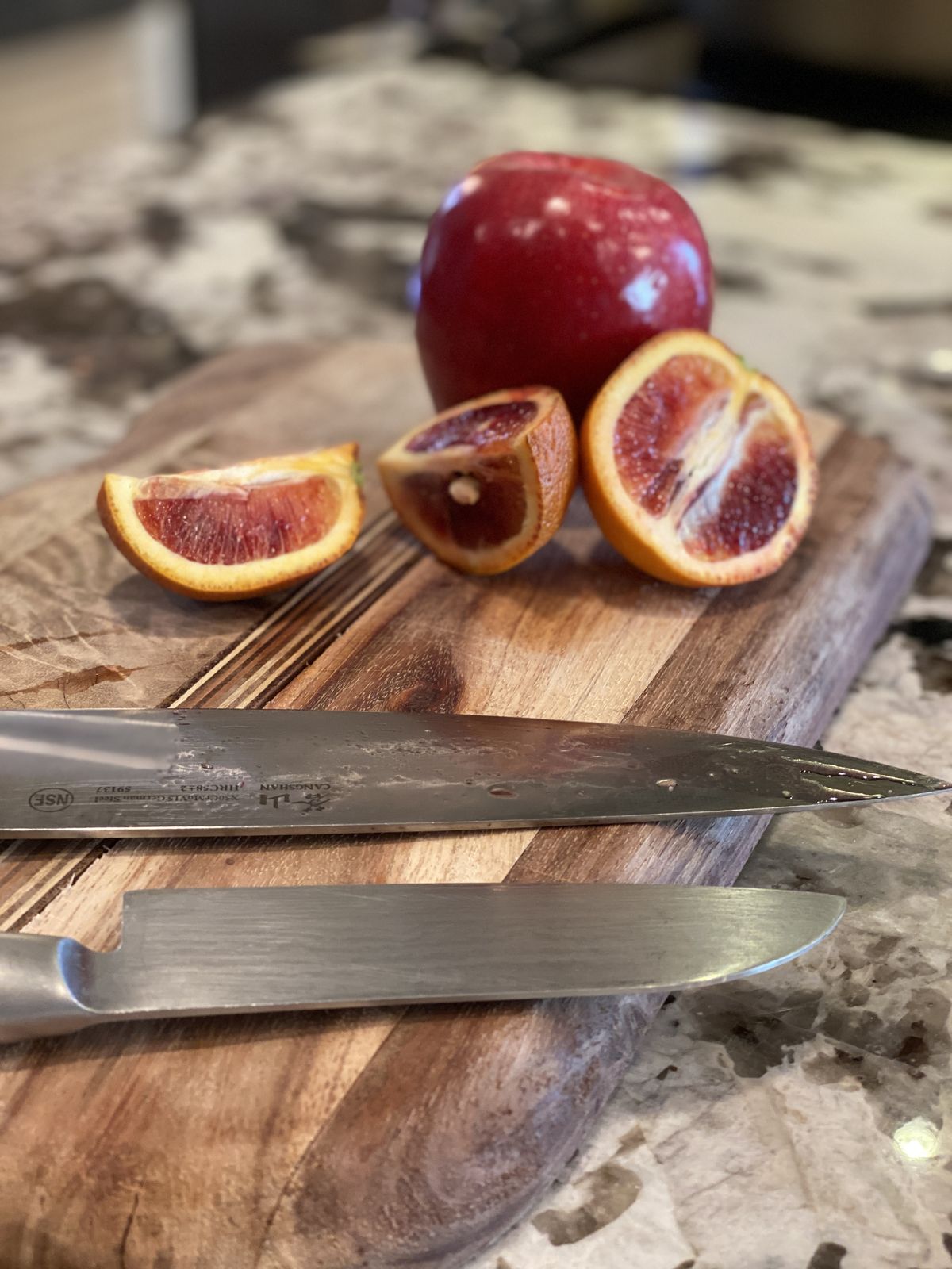 Blood oranges and chef's knives on the cutting board