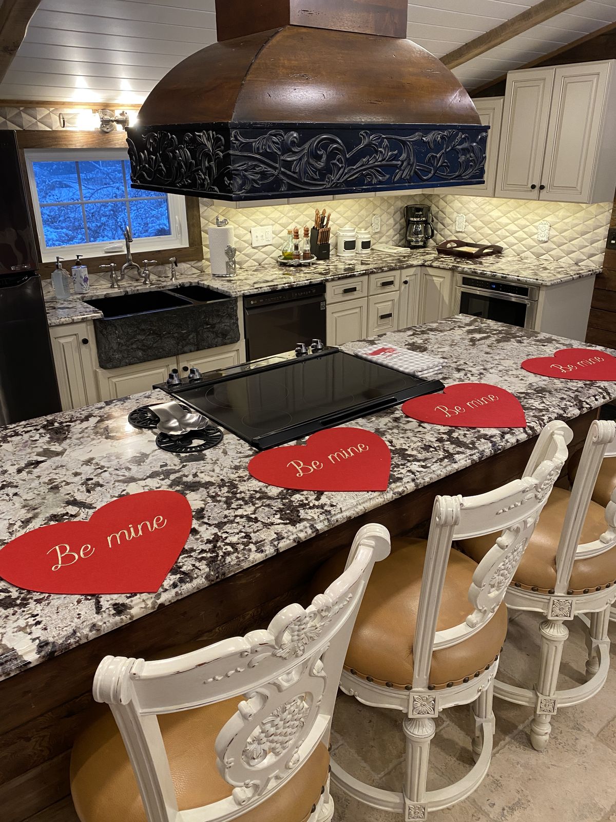 The suite dining island set for a private dinner